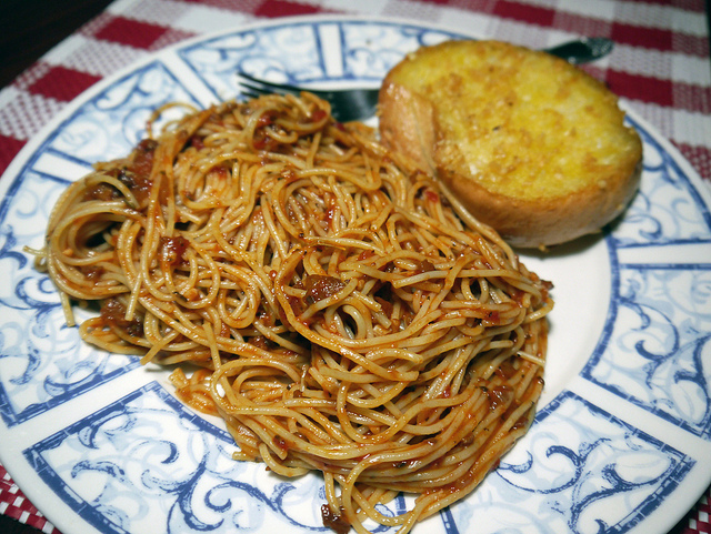 Spaghetti Marinara with garlic bread, often served at italian restaurants in the US, is actually not Italian at all