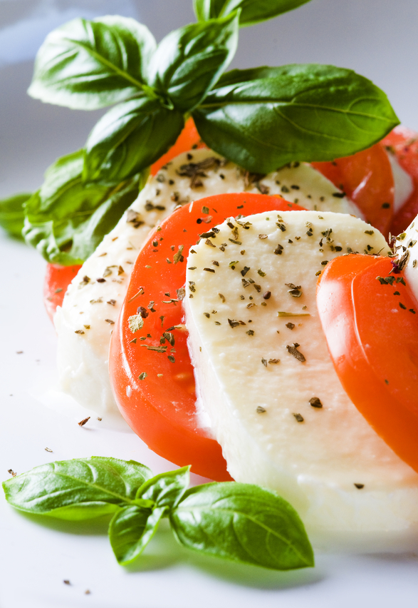 A taste of Italy: three quintessential Italian cuisine's ingredients, mozzarella, tomatoes and fresh basill