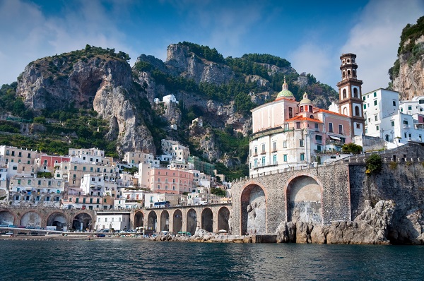 Italy viewed from the sea: the Amalfi Coast, view of the bridge in Amalfi, and the town facing the sea and going up the mountain