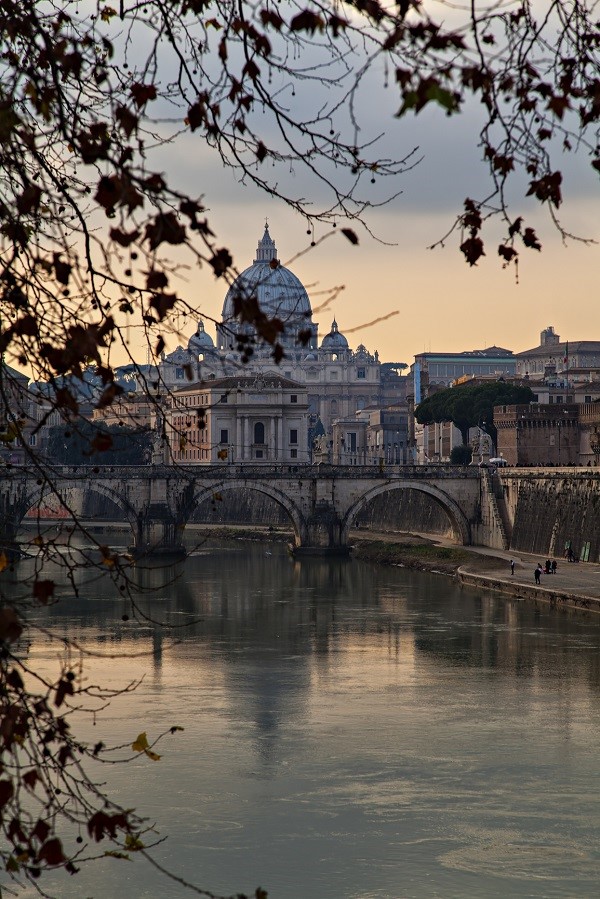 Italy viewed from a river: the Tiber and Rome in the evening 