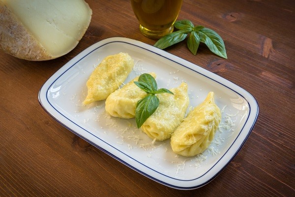 Culurgiones, ravioli stuffed with potato, mint and pecorino, traditional recipe from Sardinia 