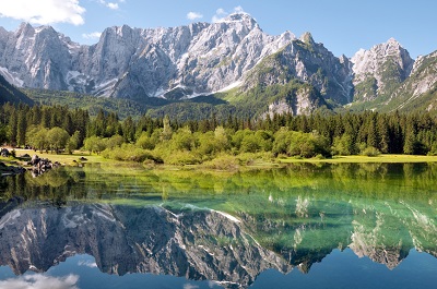 Italia – Udine – Lago di Fusine and monte Mangart reflex on lake