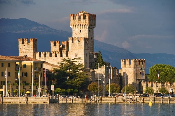 Italy viewed from the water: Castle in Sirmione by Lake Garda