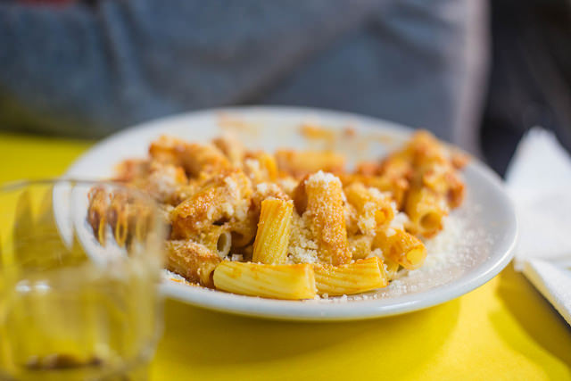 Bucatini all' Amatriciana (a version made with rigatoni), probably made with tomato concentrate 
