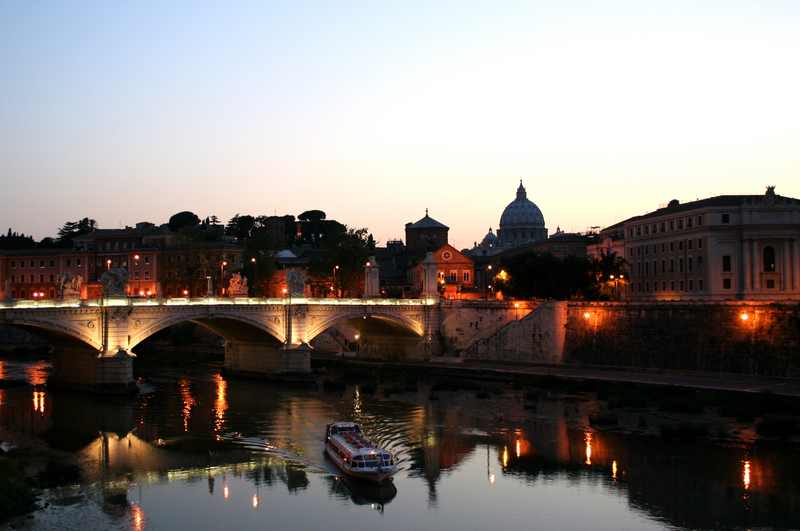 Tiber river and cruise boat in Rome, Italy