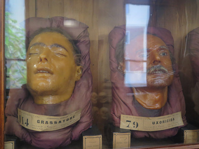 Wax masks of the Lombroso Museum: on the left, the face of a "grassatore," a robber. On the right, that of a wife killer, "uxoricida" 